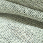 Pletenina smetanová s černým melírem