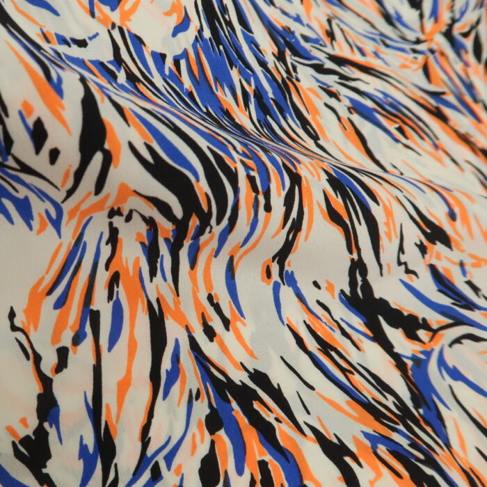 Plátno smetanové s modrým, černým a neonově oranžovým vzorem z hedvábí