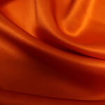 Satén tmavě oranžový