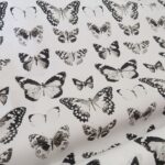 Plátno smetanové s černými motýli