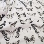 Plátno smetanové s černými motýli