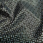 Podšívka khaki zelená s bílým drobným geometrickým vzorem