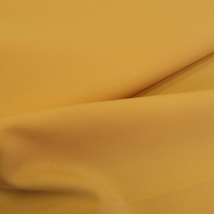 Vlněný serž žlutý s elastanem
