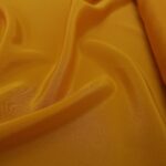 Krepdešín žluto-oranžový