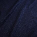 Batist modrý s hustou výšivkou