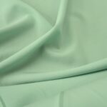 Kostýmovka mentolově zelená