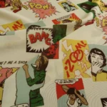 Šifon bílý s barevným komiksovým vzorem