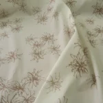 Popelín vanilkově žlutý s hnědými stylizovanými květy
