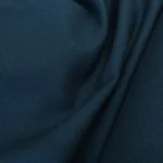 Vlněný serž petrolejový